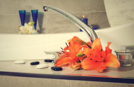 water tap with flowers in spa salon.shallow DOF