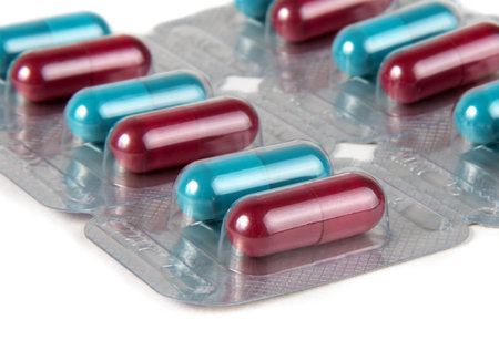 medicine pills over white surface