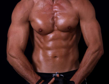 shape of sporty male body on darkの写真素材