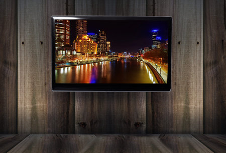 wooden backround with tv and Melbourne landscape