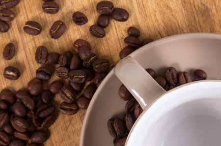 coffee cup and  beans closeup on table
