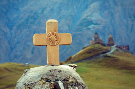 The cross and Holy Trinity Church. Kazbegi. Georgiaの写真素材