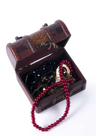 old treasure chest with jewelry  on whiteの写真素材
