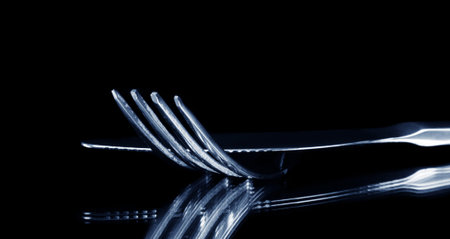 fork and knife on black,shallow DOF