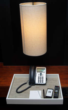 hotel objects: lamp,notepaper and phoneの写真素材