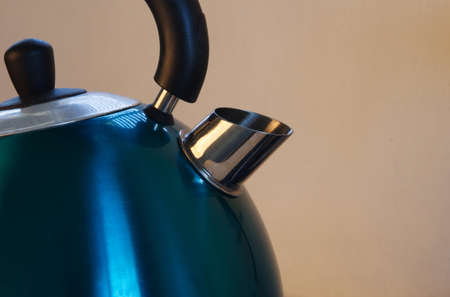 metal kettle closeup in kitchenの写真素材