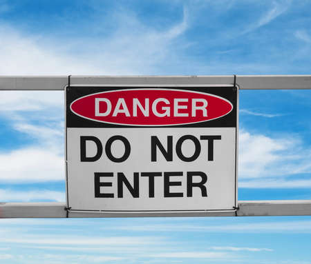 do not enter.danger sign on skyの写真素材