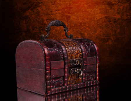 vintage treasure chest closeup on blackの写真素材