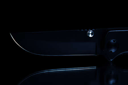 silhouette of the knife blade on blackの写真素材