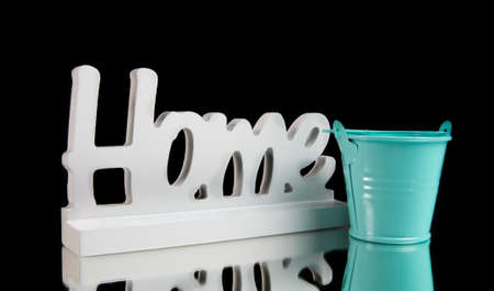 home sign with bucket on blackの写真素材