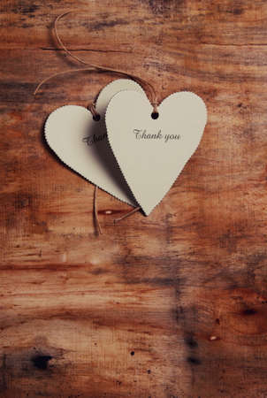abstract paper heart on wooden tableの写真素材