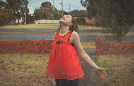 girl portrait outside in rain,shallow DOFの写真素材