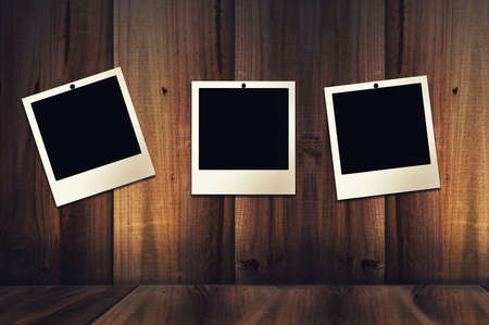 old instant photo hanging on wallの写真素材