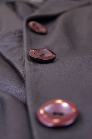 button on the leather coatの写真素材