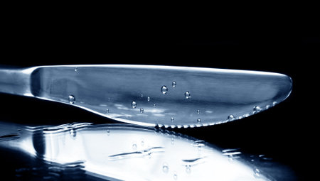knife with drops on black