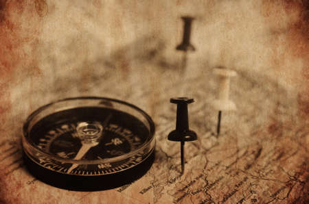 Pins and compass destination in the map.Vintage textured pictureの写真素材