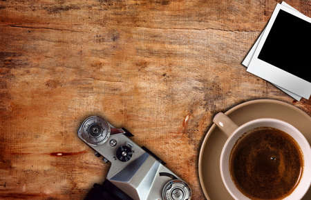 old camera and coffee  on table,top viewの写真素材