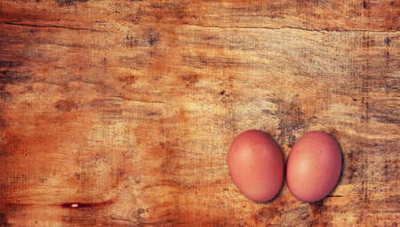 eggs on the wood table.top viewの写真素材