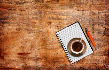 top view of coffee and notepadの写真素材