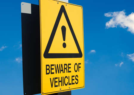 beware of vehicles road sign closeupの写真素材