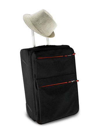 travel suitcase and hat over white