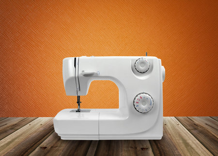 sewing machine on wooden surface