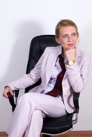 pretty blonde business woman on chair