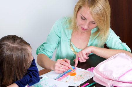 mother with daughter drawing together