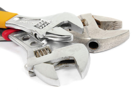 old  and rusty wrenches on white