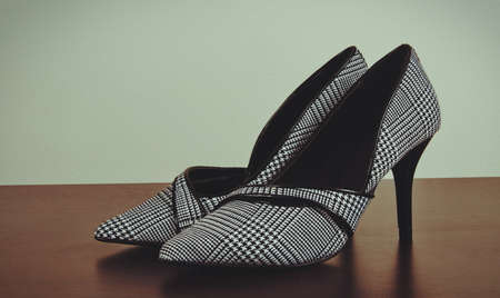 female elegant shoes on tableの写真素材