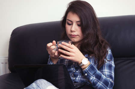 brunette girl using the laptopの写真素材