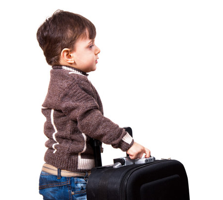 child with travel  bag going for holidayの写真素材
