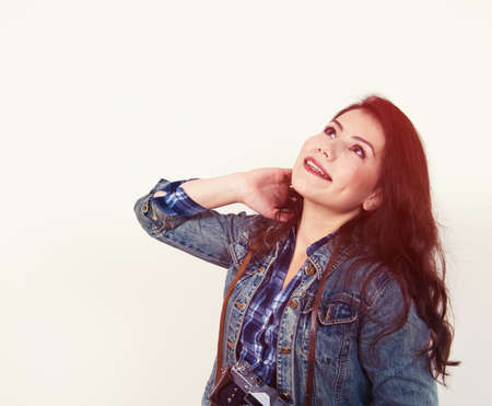 portrait of brunette girl with retro cameraの写真素材