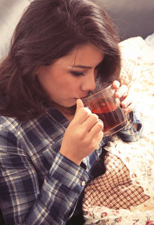 brunette girl with teaの写真素材