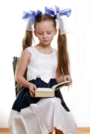 little girl with the bookの写真素材