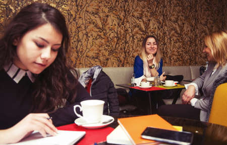 women in old cafe working or learningの写真素材