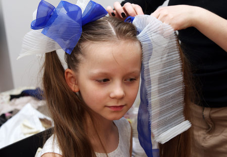 doing hair style to the girl