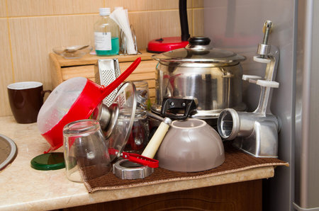 washed dishes closeup in kitchenの写真素材