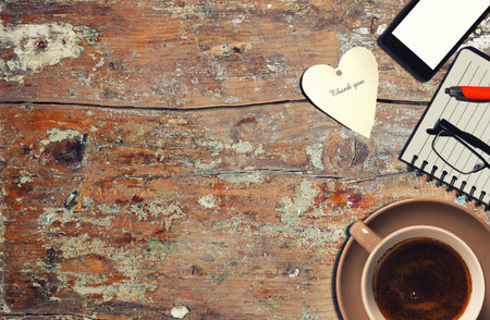 cup of coffee with notepad. top viewの写真素材