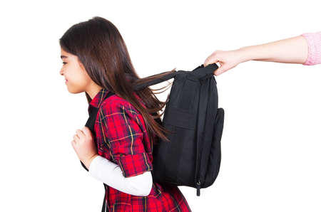 hand holding schoolgirl from walkingの写真素材