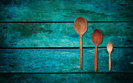 wooden mixing spoons on tableの写真素材