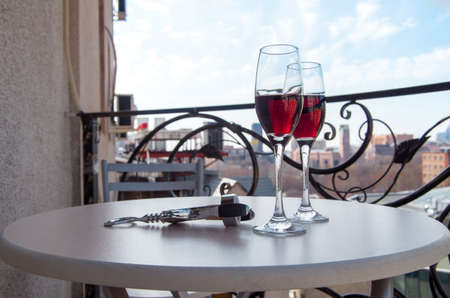 glasses of wine on the balconyの写真素材