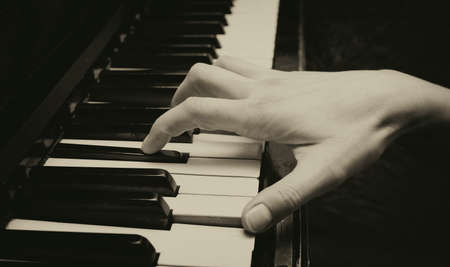 playing the piano closeup, toned pictureの写真素材