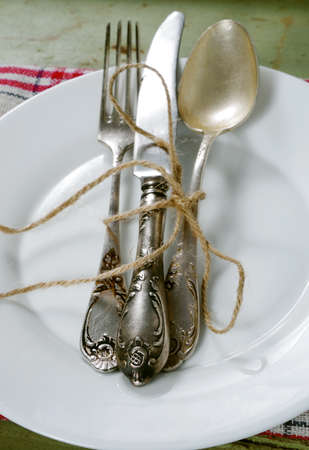retro cutlery on plate closeupの写真素材