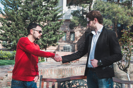 young business men shaking handsの写真素材