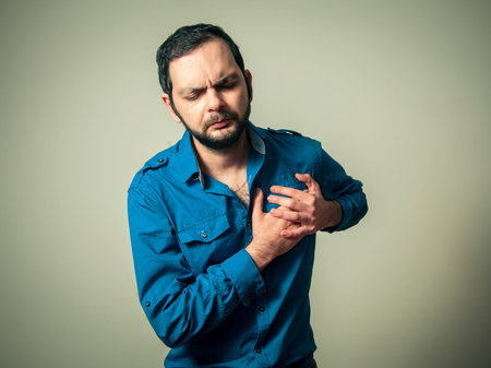 bearded man having heart pain