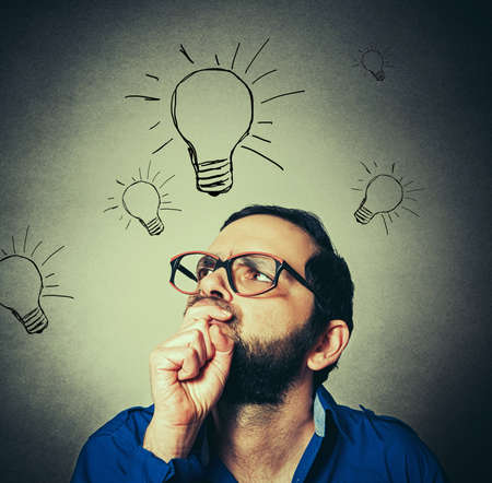 casual man with the beard thinkingの写真素材