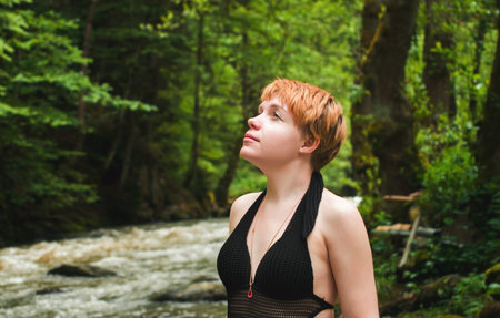 pretty girl in forest near river