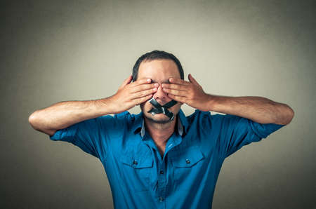 portrait of man with the taped mouthの写真素材