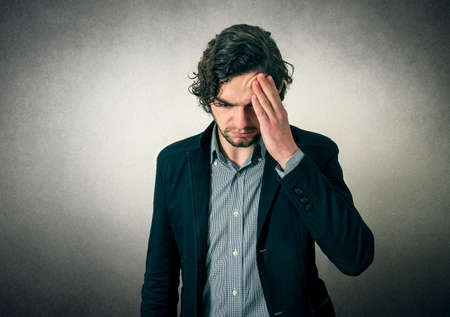Bearded man thinking or has head painの写真素材